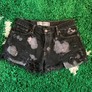 Levi’s distressed black shorts, bleached